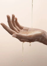Hand holding a stream of ONNYBODY body wash