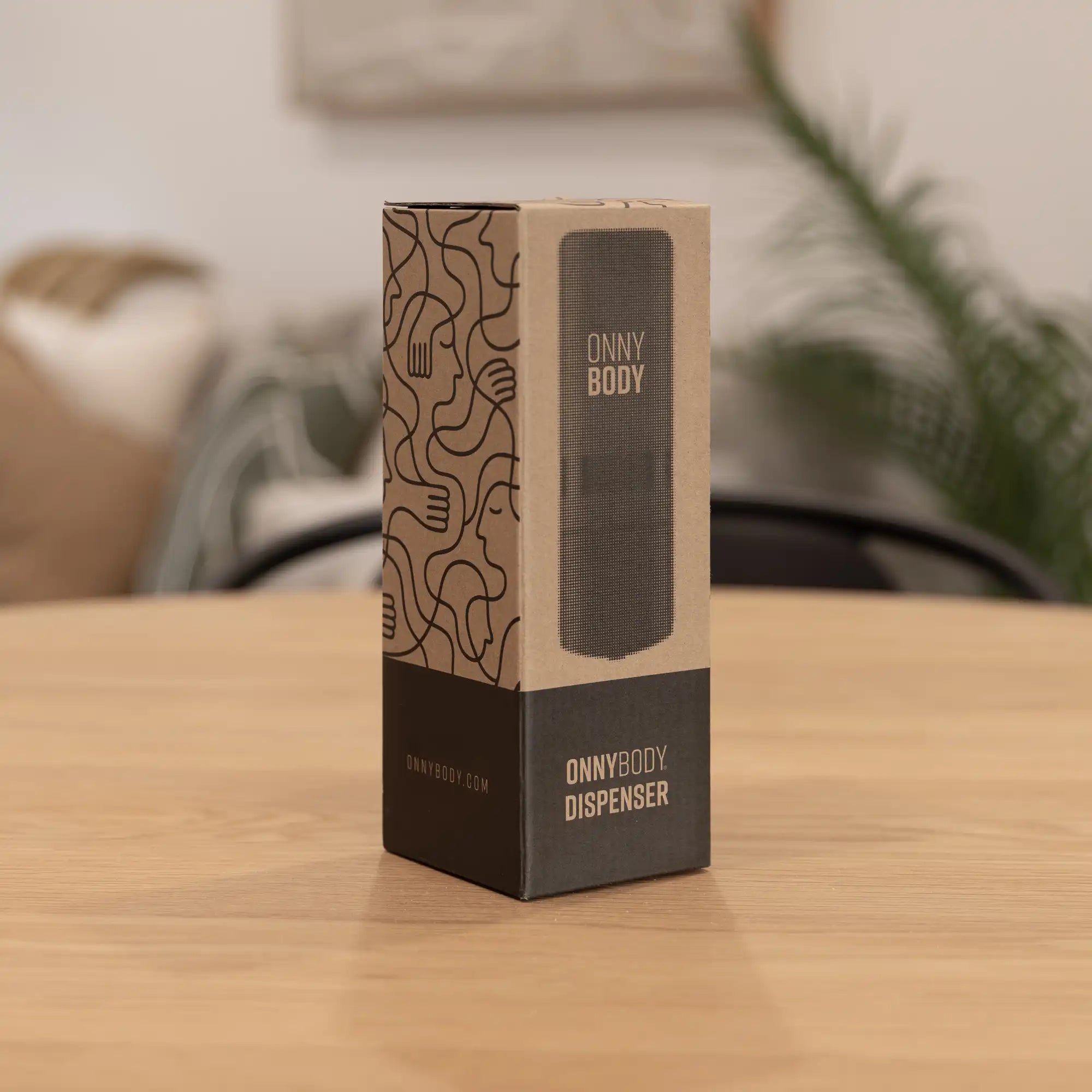ONNYBODY dispenser packaging on a wooden table with a blurred background