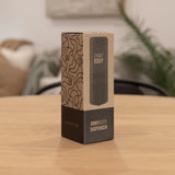 ONNYBODY dispenser packaging on a wooden table with a blurred background