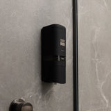 one black ONNYBODY dispenser attached to a tiled bathroom wall.