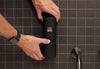 Showing how the ONNYBODY body & Hair care wall dispenser is attached to the wall and how the labels are applied.